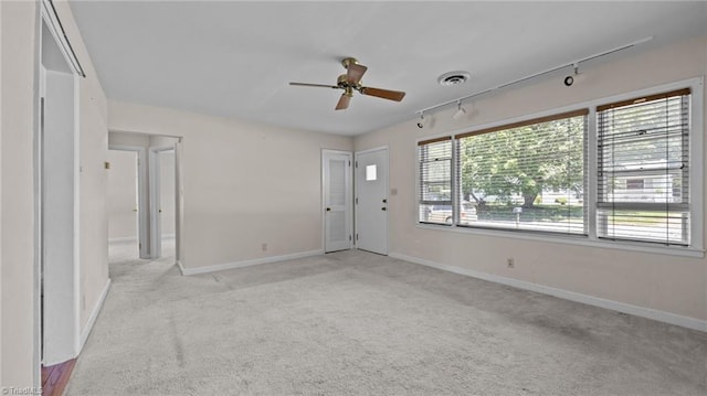 626 State Ave, High Point, NC 27262 - spare room with light carpet, track lighting, and ceiling fan