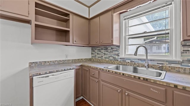 626 State Ave, High Point, NC 27262 - kitchen with white dishwasher, backsplash, light countertops, and open shelves