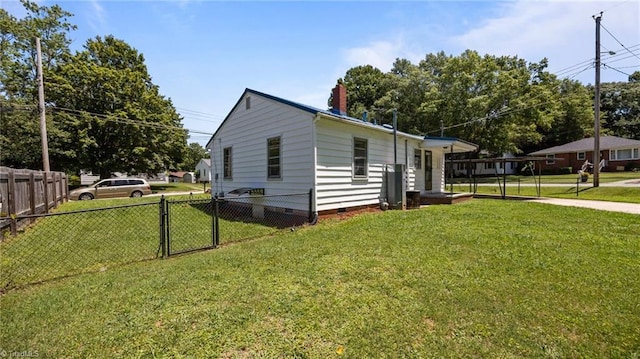 626 State Ave, High Point, NC 27262 - view of side of home featuring crawl space, a chimney, and a carport