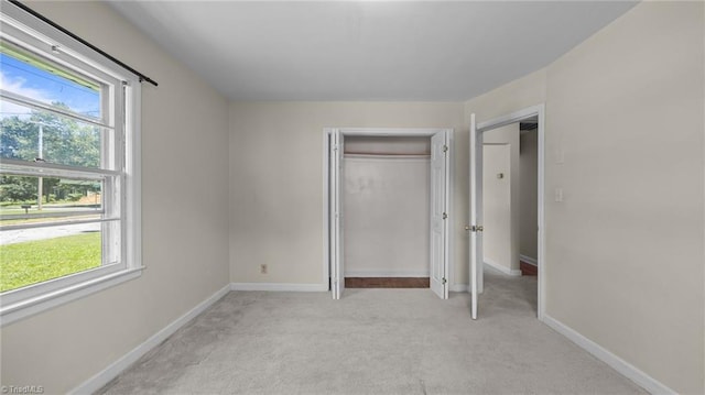 626 State Ave, High Point, NC 27262 - unfurnished bedroom featuring light carpet and a closet
