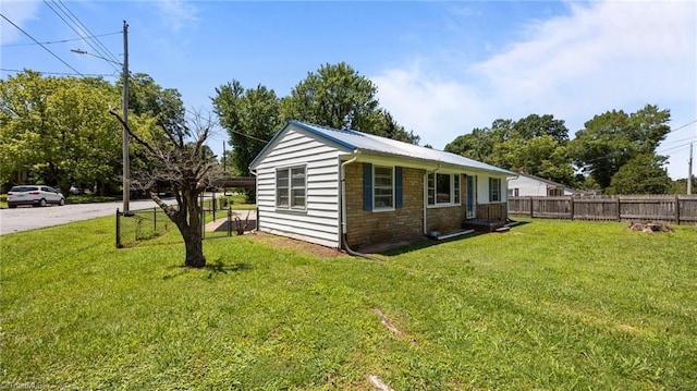 626 State Ave, High Point, NC 27262 - view of property exterior featuring stone siding and a metal roof