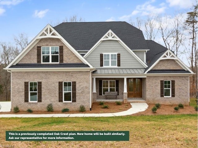 craftsman-style home featuring brick siding, a porch, and a front yard