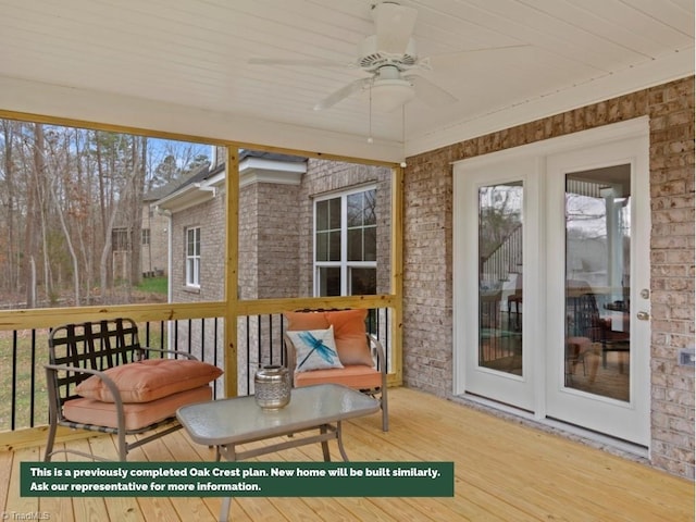 sunroom / solarium with a healthy amount of sunlight and ceiling fan