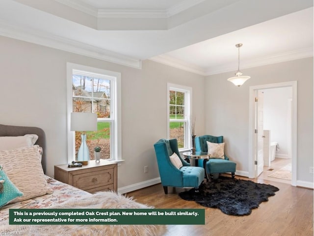 bedroom with ornamental molding, ensuite bath, baseboards, and wood finished floors