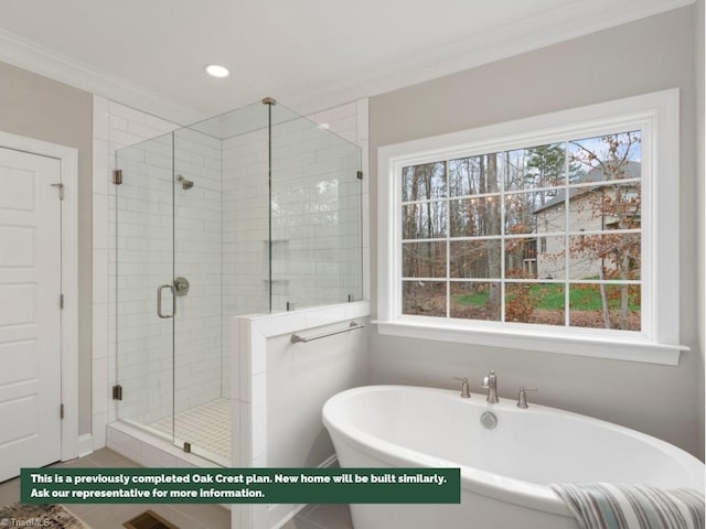 full bathroom featuring a stall shower, a soaking tub, a healthy amount of sunlight, and crown molding