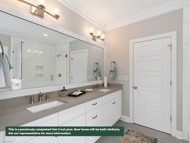 full bath with double vanity, crown molding, a sink, and a shower stall