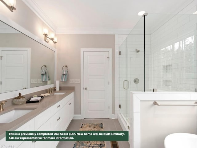 bathroom with double vanity, a stall shower, crown molding, and a sink