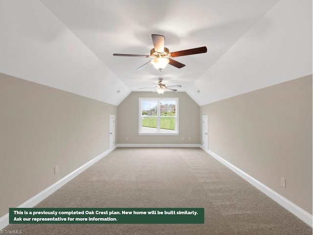 additional living space with vaulted ceiling, carpet floors, and baseboards