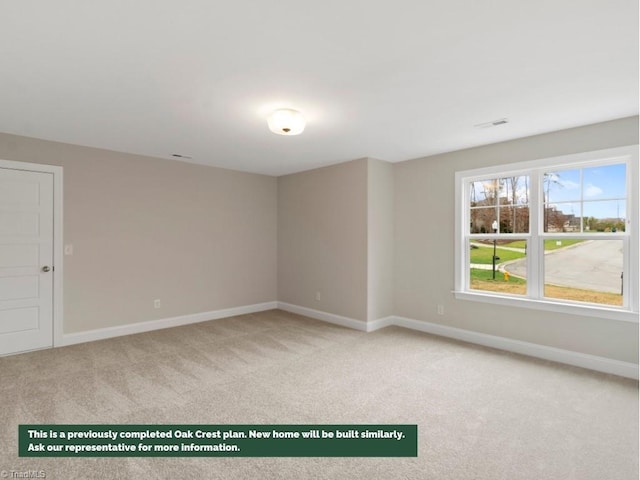 unfurnished room featuring light colored carpet, visible vents, and baseboards