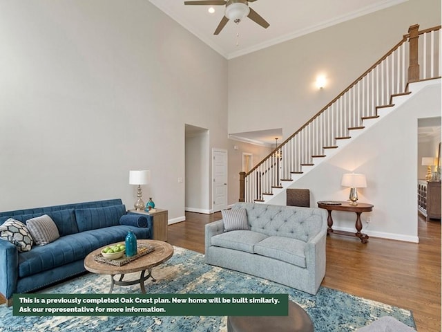 living room featuring stairway, wood finished floors, and baseboards