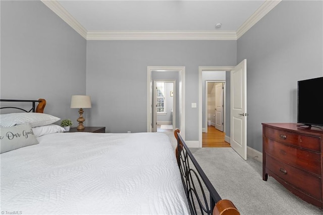 carpeted bedroom with baseboards and ornamental molding