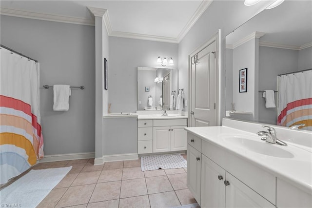 bathroom with tile patterned flooring, a sink, two vanities, and ornamental molding