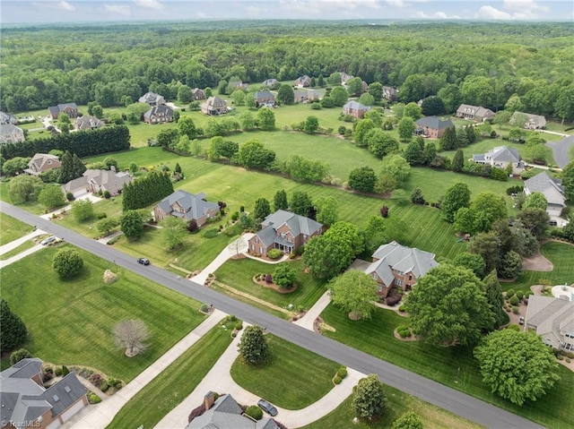bird's eye view with a view of trees and a residential view