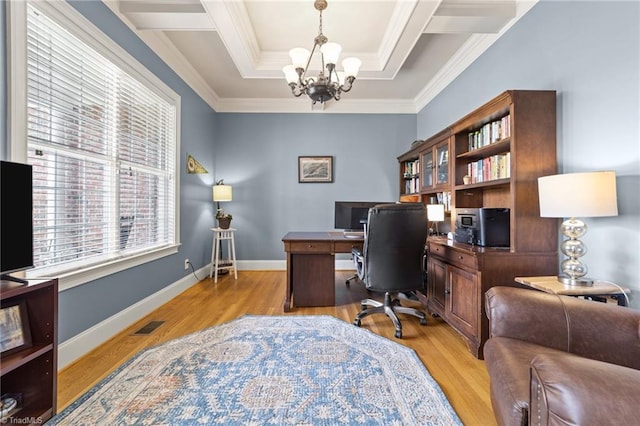 office area featuring crown molding, a raised ceiling, light wood finished floors, and a notable chandelier