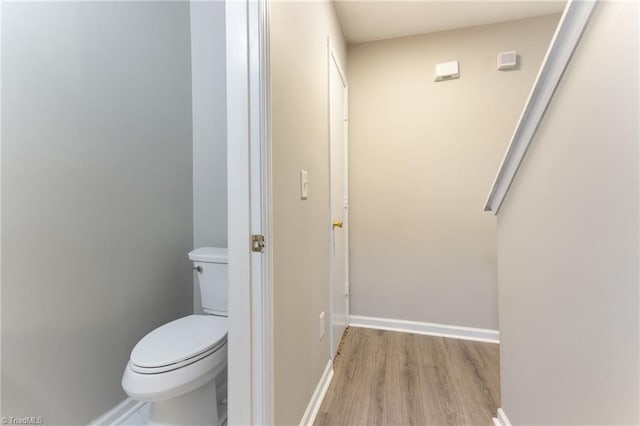 3602 Turquoise Dr, Durham, NC 27703 - bathroom featuring wood finished floors, toilet, and baseboards