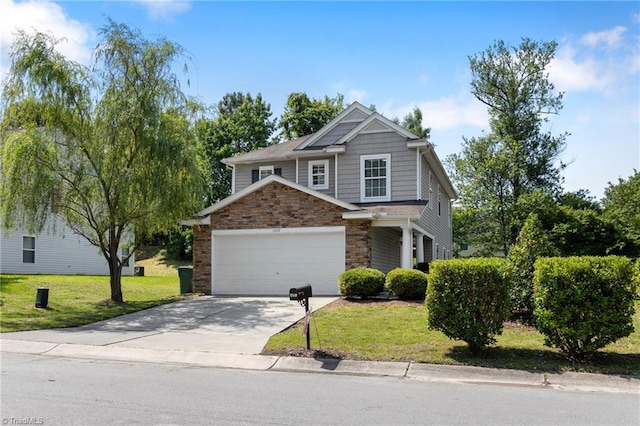 3602 Turquoise Dr, Durham, NC 27703 - view of front of property featuring concrete driveway, a front yard, an attached garage, and stone siding