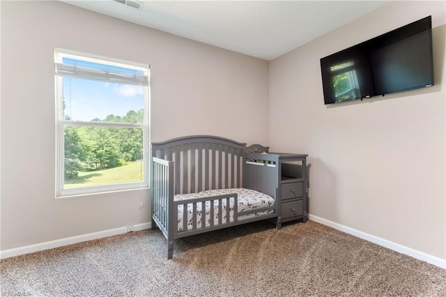 3602 Turquoise Dr, Durham, NC 27703 - bedroom with multiple windows, carpet floors, and baseboards