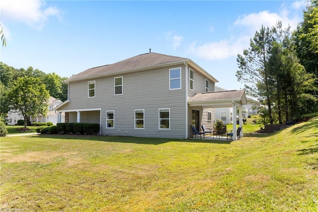 3602 Turquoise Dr, Durham, NC 27703 - back of property featuring a patio area and a yard