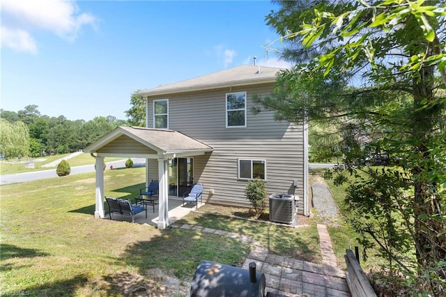 3602 Turquoise Dr, Durham, NC 27703 - back of house with a patio, a lawn, and central AC unit