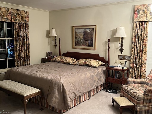 carpeted bedroom featuring ornamental molding