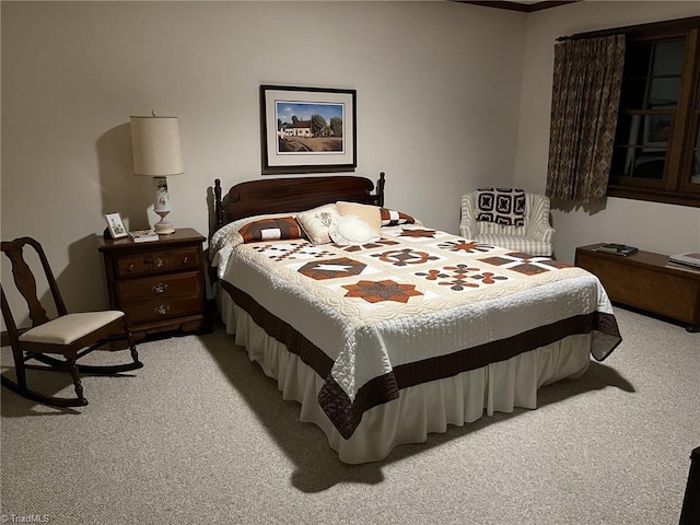 bedroom with light colored carpet and ornamental molding