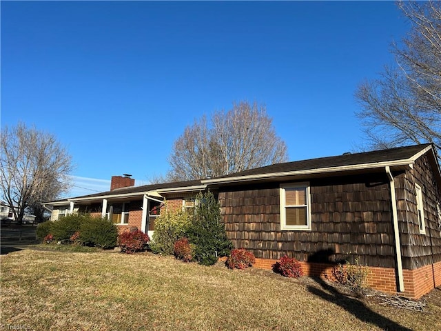 view of property exterior with a yard