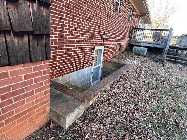 view of home's exterior featuring a wooden deck