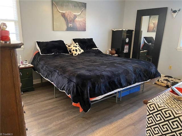 bedroom with wood-type flooring