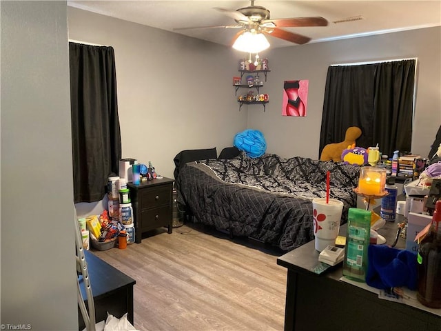 bedroom featuring ceiling fan and light wood-type flooring