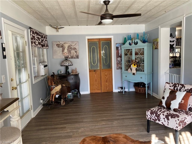 living area with ceiling fan and dark wood-type flooring