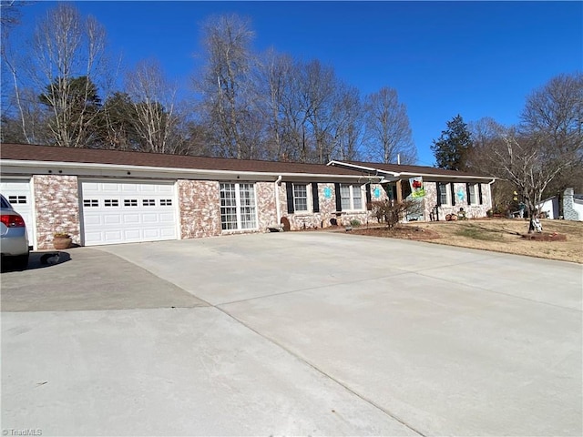 ranch-style home featuring a garage