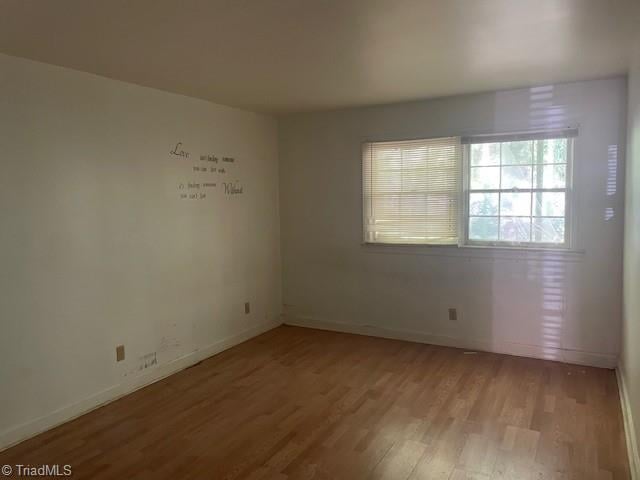 2821 Bleeker Sq Unit C, Winston-Salem, NC 27106 - spare room featuring light wood-type flooring and baseboards