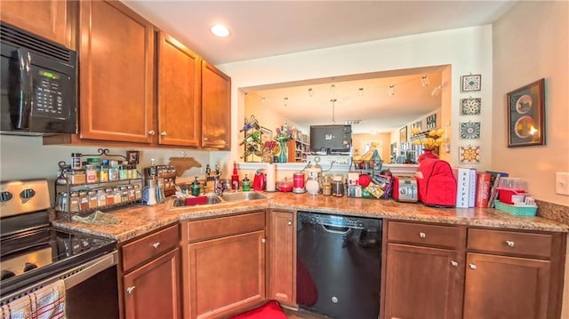 104 Tilleys Grove Dr, Kernersville, NC 27284 - kitchen featuring black appliances, a peninsula, brown cabinetry, and recessed lighting
