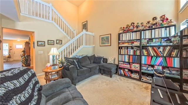 104 Tilleys Grove Dr, Kernersville, NC 27284 - living room with carpet flooring, stairway, and a high ceiling