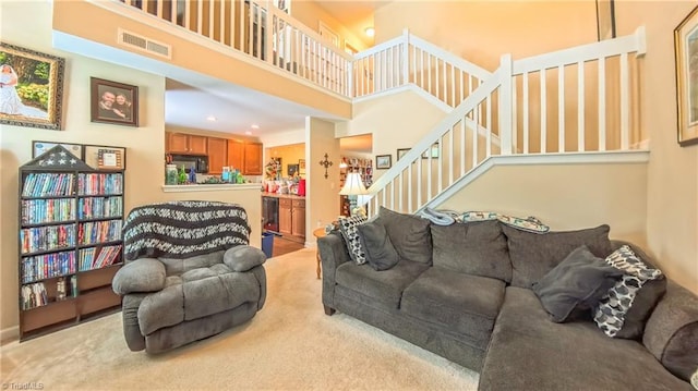104 Tilleys Grove Dr, Kernersville, NC 27284 - carpeted living area with a towering ceiling, stairs, and recessed lighting