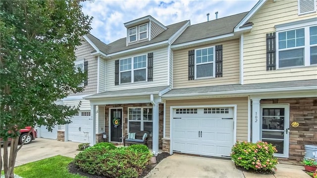 104 Tilleys Grove Dr, Kernersville, NC 27284 - multi unit property with covered porch, driveway, stone siding, and a garage
