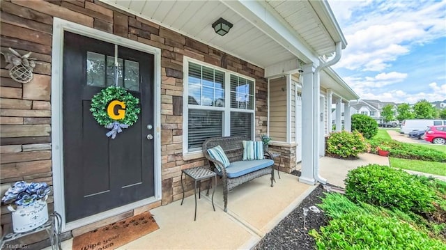 104 Tilleys Grove Dr, Kernersville, NC 27284 - property entrance featuring covered porch and stone siding