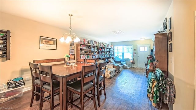 104 Tilleys Grove Dr, Kernersville, NC 27284 - dining area featuring dark wood-type flooring and a chandelier