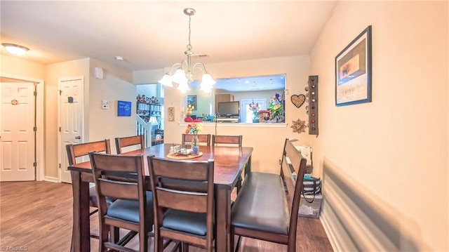 104 Tilleys Grove Dr, Kernersville, NC 27284 - dining room with a chandelier and wood finished floors