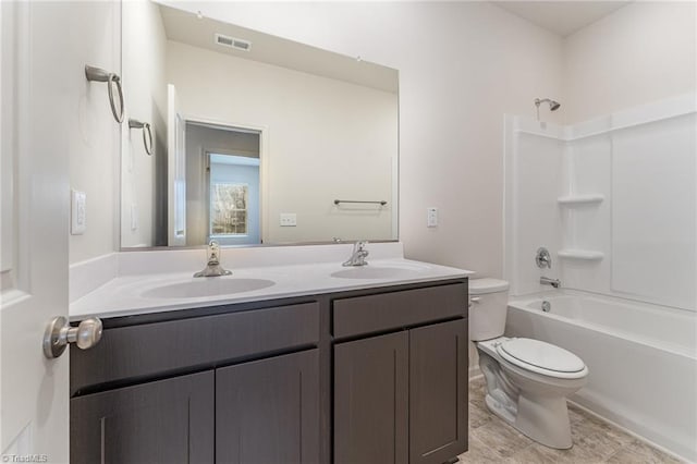 full bathroom with  shower combination, toilet, and vanity