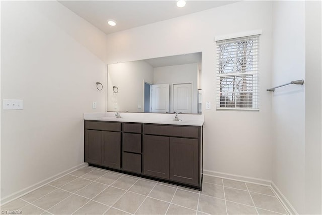 bathroom with tile patterned flooring and vanity