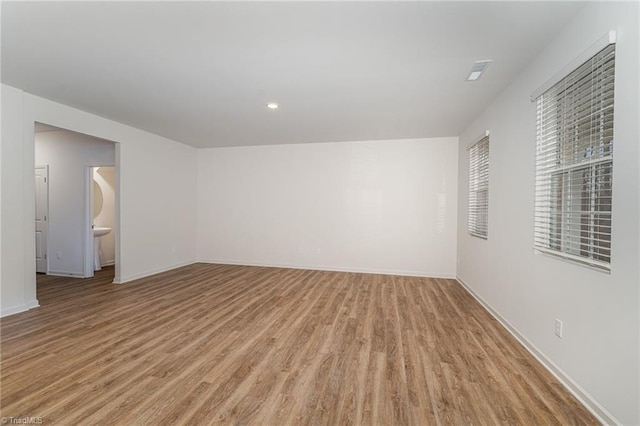 empty room with light hardwood / wood-style floors