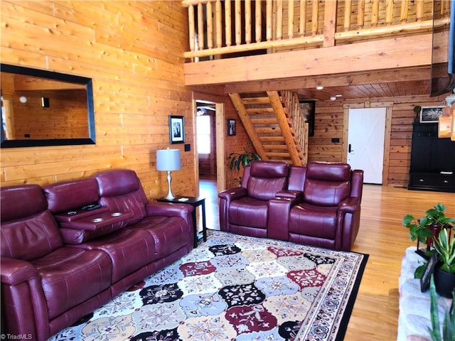 living room featuring wood walls and hardwood / wood-style flooring