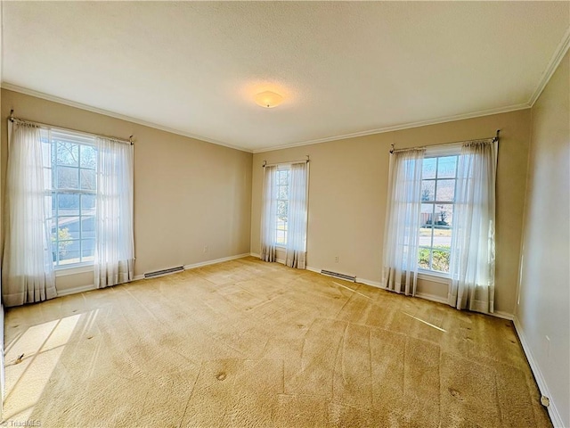 carpeted spare room featuring baseboards, visible vents, ornamental molding, baseboard heating, and a textured ceiling