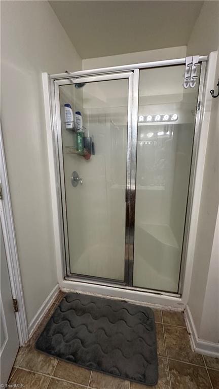 bathroom featuring an enclosed shower