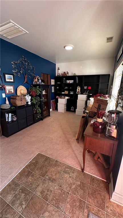 office area with dark colored carpet