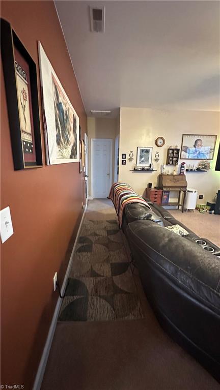 hallway featuring carpet floors