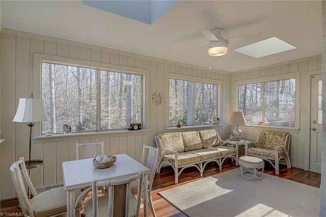 sunroom featuring a skylight and ceiling fan