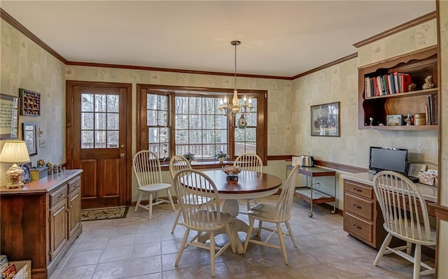 dining area with ornamental molding, a chandelier, and wallpapered walls