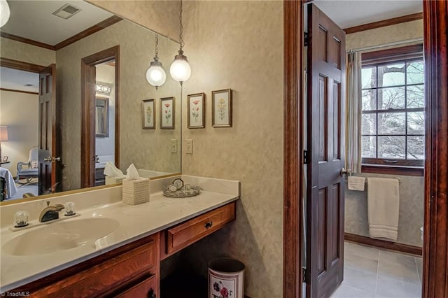 bathroom featuring visible vents, ornamental molding, vanity, tile patterned flooring, and baseboards